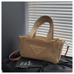Detail of the natural woven texture and triangle motif on this light brown crochet bag