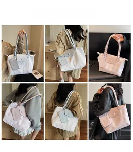 Detail of blue and pink cartoon tote bag set with matching inner pouch and shoulder strap
