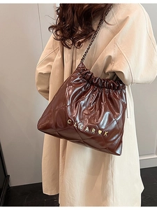 Quilted dark brown leather bucket bag with gold chain strap and drawstring closure