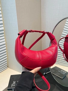 Red lychee pattern leather crescent handbag with knot handle and shoulder strap