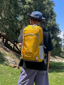 Outdoor 40L hiking backpack in yellow color with ergonomic straps for mountain trekking