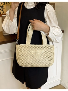 Beige hollow knit tote bag with triangle logo and brown leather straps for beach holidays