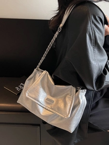Silver metallic chain shoulder bag with pleated texture and stylish crossbody design