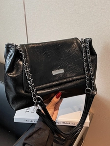 Chic black oil wax leather chain shoulder bag with metal buckle in a large tote style