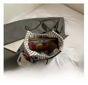 Macro shot of striped canvas tote interior showing spacious storage for daily essentials
