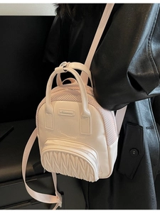 Chic light pink mini backpack with pleated details and mesh panels for stylish women