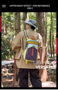 Outdoor view of a colorful hiking backpack with a drawstring closure and buckle details