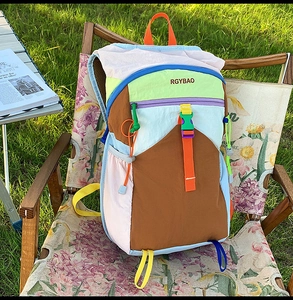 Detail of colorful hiking backpack with water-resistant nylon fabric and logo