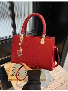 Elegant red leather wedding handbag with floral relief and pearl Xi character charm