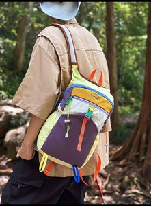 Close-up of vibrant multi-color hiking backpack showing durable nylon fabric and details