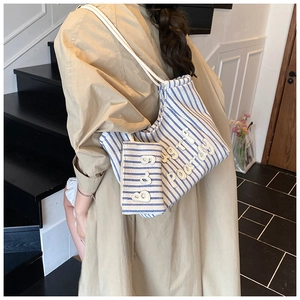 Blue and white striped canvas tote set with delicate 3D embroidery and drawstring closure