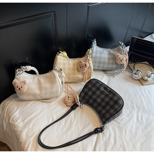 Selection of checkered underarm bags in four colors with cute plush bear charms