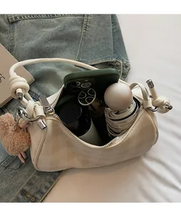 Canvas checkered crescent bag interior showing spacious storage for phone and umbrella