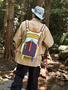 Multi-color patchwork outdoor backpack in purple and yellow with durable nylon fabric