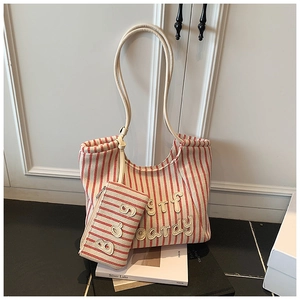 Detail of red striped canvas tote bag set with surf boardy embroidery and small pouch