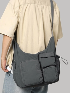 Grey large capacity messenger bag with multiple utility pockets and adjustable strap