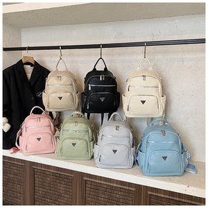 Detailed display of casual backpacks in seven colors showing pebbled leather texture