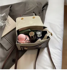 Top view of contrast color backpack interior showing ample space for phone and umbrella