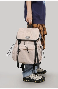 Detail view of large nylon outdoor backpack with multi-pocket and buckle closure