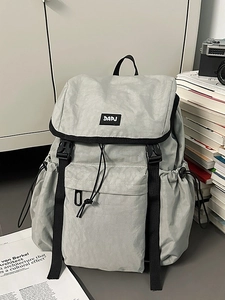 Light grey outdoor hiking backpack with durable nylon fabric and multi-pocket design