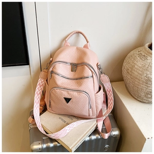 Pink lychee texture leather backpack featuring chic geometric woven wide shoulder straps