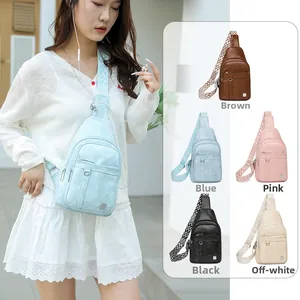 Detail view of stylish crossbody chest bags with wide patterned straps in five colors