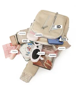 Spacious beige crossbody bag displaying storage for iPad, umbrella, and daily essentials