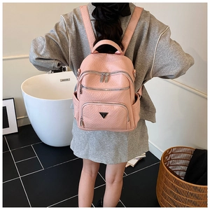Pink lychee grain small backpack with multi-layer zippers and triangle logo detail