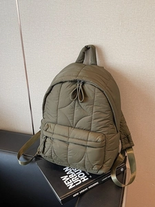 Army green quilted puffer backpack with large capacity for travel and daily commute use