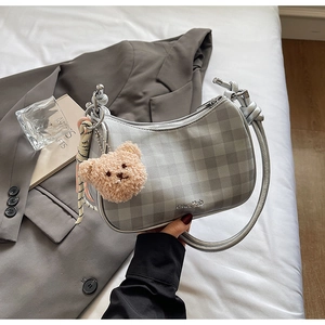 Gray checkered hobo shoulder bag with a cute bear charm and woven strap detail