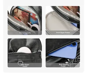 Detail view of black pebble leather crossbody bag showing multi-pocket storage capacity