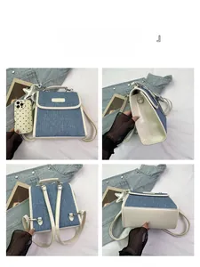 Detailed views of trapezoidal denim and white leather backpack with metal buckle