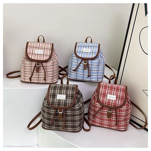 Mini plaid canvas backpacks in pink blue brown and red with leather trim detail