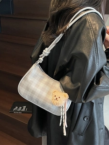 Grey checkered underarm bag with knotted strap and cute bear charm for daily wear