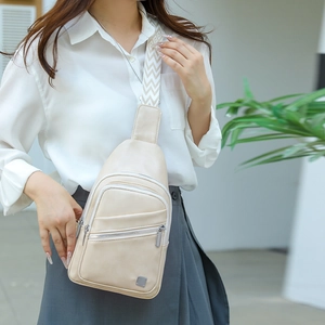 Detail of off-white multi-layer crossbody bag with geometric jacquard strap and metal logo