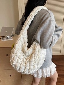 Stylish white quilted cloud shoulder bag for women featuring a spacious hobo design
