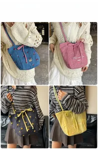 Detailed views of double-sided tote bags in blue cherry, floral, and plaid canvas patterns