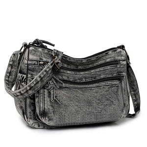 Sac bandoulière en denim délavé gris foncé avec poches zippées et bandoulière réglable