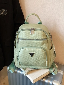 Trendy light green faux leather backpack for women featuring a triangle metal logo