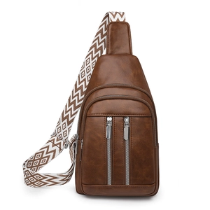 Brown vintage faux leather crossbody bag with triple zippers and patterned wide strap