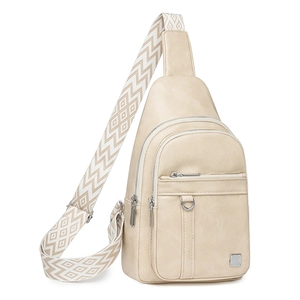 Detail view of beige crossbody bag with multi-layer zippers and geometric strap