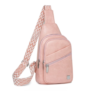 Detail view of light pink PU leather chest bag with a wide geometric woven shoulder strap