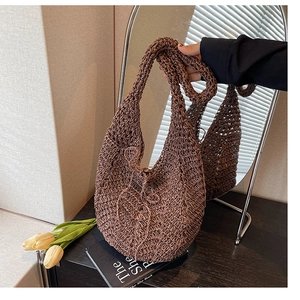 Detail of dark brown crochet knit tote bag with mesh hollow design and soft handle