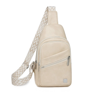 Detail of off-white faux leather chest bag with geometric diamond pattern strap
