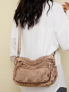 Sac bandoulière en denim délavé marron avec poches zippées multiples et sangle tissu
