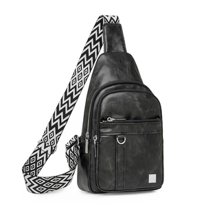 Detail view of black PU leather chest bag featuring a stylish geometric woven shoulder strap