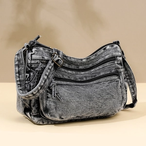 Vintage dark gray washed denim crossbody bag with multiple zip pockets and wide strap