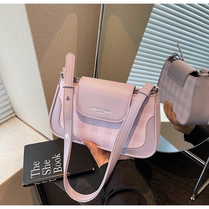 Detail of lavender plaid handbag featuring embossed lettering and premium PU leather texture