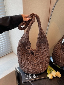 Deep brown hollow-out knitted tote bag with bow detail and vintage crochet texture