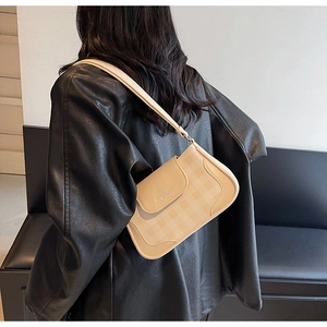 Detailed view of the plaid pattern and faux leather texture on this crossbody bag